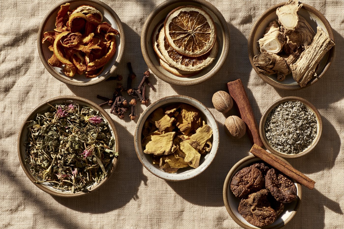 The dried botanicals laid out in small dishes